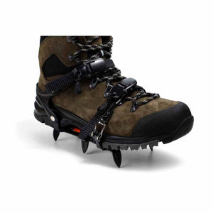 Hillsound crampons attached to a brown hiking boot