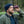 Man wearing a beanie and fleece jacket using a NOCS Provisions monocular outdoors