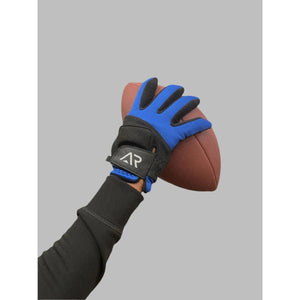 Hand wearing blue and black athletic glove holding a brown football