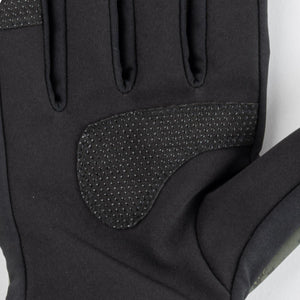 Close up of black athletic glove palm with textured grip padding