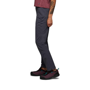 Side profile of Black Diamond grey hiking pants worn with purple hiking shoes