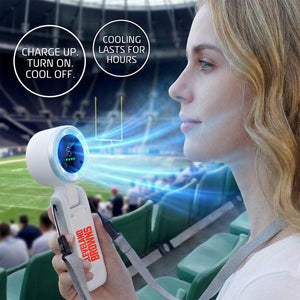 Person holding a Cleveland Browns branded portable handheld fan at a stadium