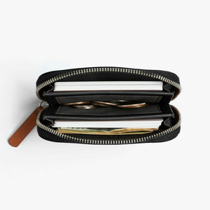 Open Bellroy wallet filled with cards cash and coins