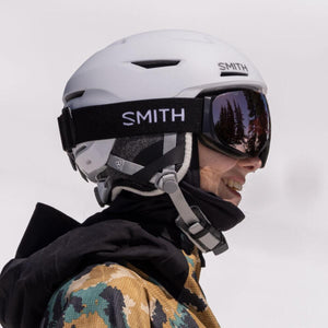 Person wearing a white Smith Optics helmet and black goggles