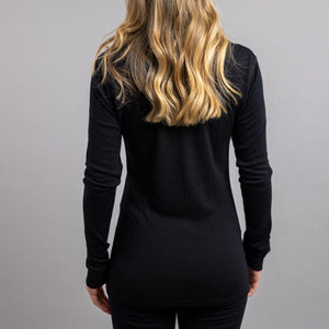 Back view of a person wearing a black Merino Skins long sleeve top