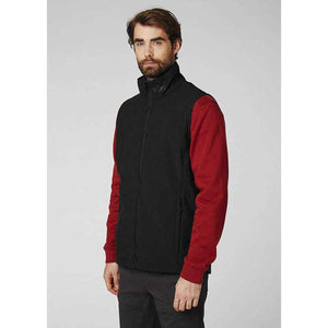 Man wearing a black Helly Hansen softshell vest over a red long sleeve shirt