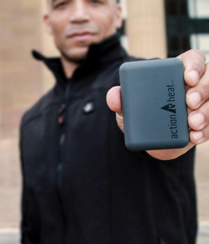 Person holding a grey ActionHeat power bank