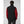 Back view of a person wearing a black Helly Hansen softshell vest over a red long sleeve shirt