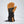 Tan and black leather winter glove with Downtek label and adjustable wrist strap