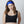 Woman wearing an Oro Sports black chest brace and blue headband