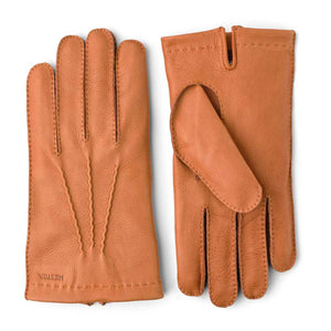 Hestra tan leather gloves with decorative stitching on the back