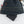 Mobile Warming black battery pack partially inserted into a dark fabric pouch with Primaloft branding