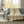 Tan and white patterned electric throw blanket draped over a grey sofa