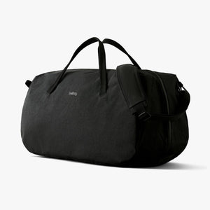Black Bellroy duffel bag with shoulder strap and carry handles