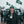 Man wearing ActionHeat jacket and New York Jets beanie holding a coffee cup in a snowy stadium parking lot