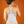 Person wearing a grey Opal back brace over a racerback sports bra against an orange background