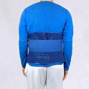 Person wearing a Polar Products blue perforated back support wrap over a blue long sleeve shirt