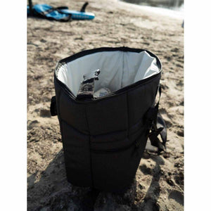 Open AO Coolers black soft cooler bag on a sandy beach