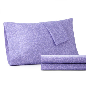 Shavel purple pillowcase and folded sheet set with white floral scroll pattern