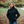 Woman wearing a black ActionHeat heated softshell jacket standing in a park