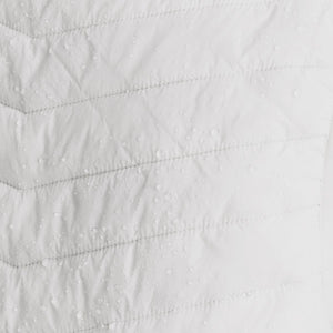 Water droplets on white quilted Venture Heat fabric