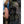 Millsound trekking poles secured in a hiking backpack side pocket
