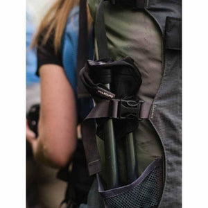 Millsound trekking poles secured in a hiking backpack side pocket