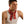 Man wearing a red paisley bandana tied around his neck with a white tank top