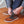 Person adjusting ActionHeat heated boots with visible internal heating elements