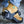 Tan work boot with a black Devisy ice cleat attachment on the heel