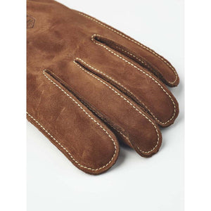 Brown suede Hestra glove fingers with visible stitching