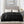 Beautyrest black heated blanket with dual controllers draped over a bed