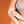 Person applying a circular adhesive patch to their elbow