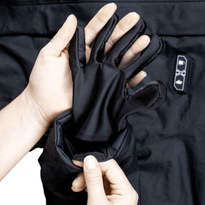 FNDN black glove liner being inserted into a jacket sleeve