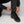 Person adjusting FjallRaven trousers over black leather hiking boots