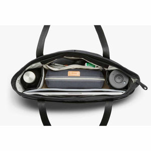 Top view of open Bellroy tote bag showing organized laptop, water bottle, and accessory pouch compartments