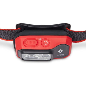 Black Diamond Storm headlamp with red and black casing and adjustable strap