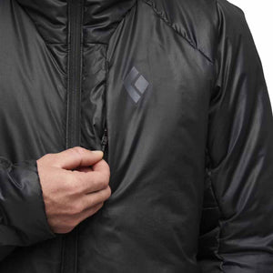 Hand pulling the zipper on a black Black Diamond jacket