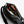 Open Bellroy black sling bag showing internal compartments with a water bottle and accessories
