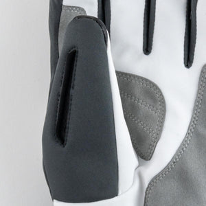 Close up of white and grey motorcycle glove with protective padding