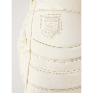 Close up of Hestra logo embossed on white leather glove