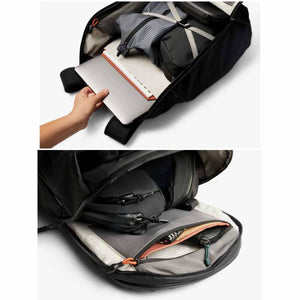Open black backpack showing laptop compartment and internal organization pouches