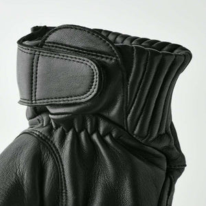 Hestra black leather glove cuff with velcro strap and ribbed detailing