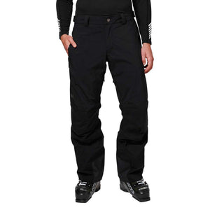 Helly Hansen black ski pants worn with ski boots