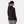 Back view of a woman wearing a black Helly Hansen hooded jacket