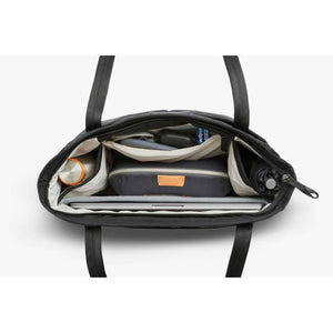 Top view of open Bellroy tote bag filled with laptop, pouch, water bottle, and umbrella