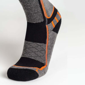 Mobile Warming grey and black performance sock with orange accent stitching