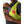 Person wearing a neon yellow Nathan hydration vest with a smartphone and energy gel in the front pockets