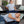 Man sitting on sofa holding back and lying on sofa using wellness mat