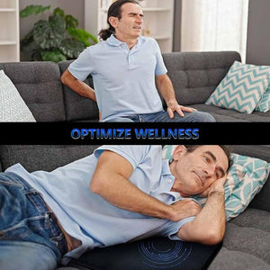 Man sitting on sofa holding back and lying on sofa using wellness mat